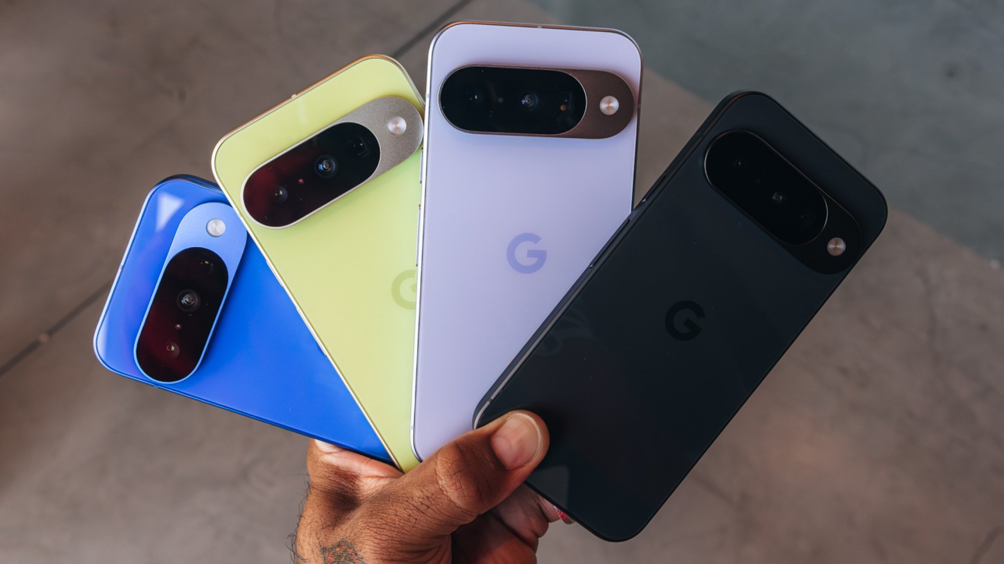 google pixel phones held by a hand