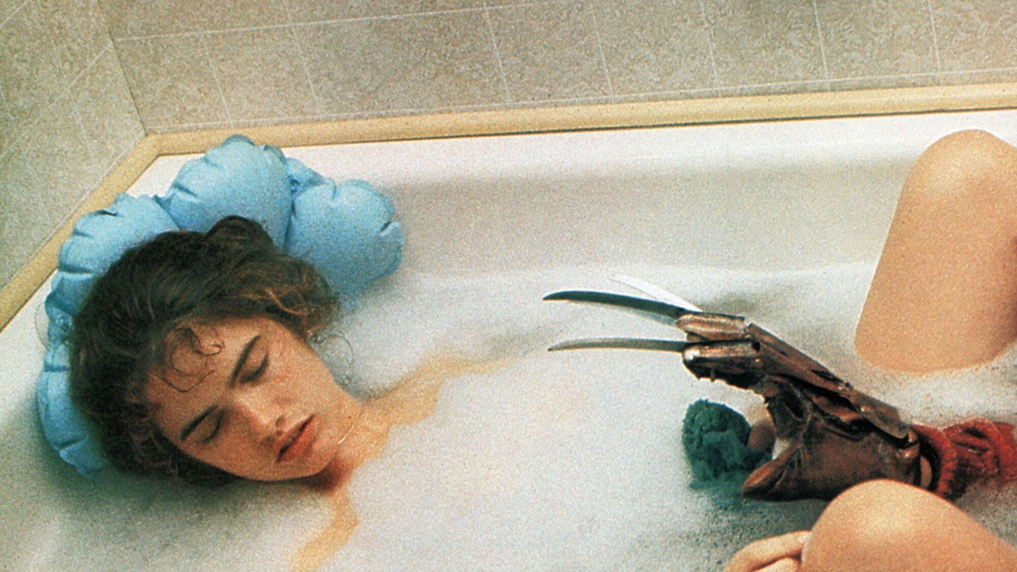 Heather Langenkamp takes a spooky nap in a bath in